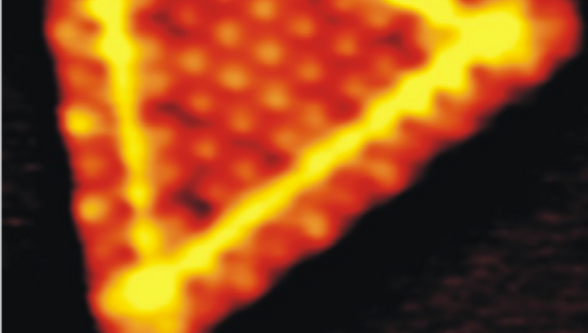 Microscopic view of material interfaces highlighting advanced research on interactions between phases in materials science.